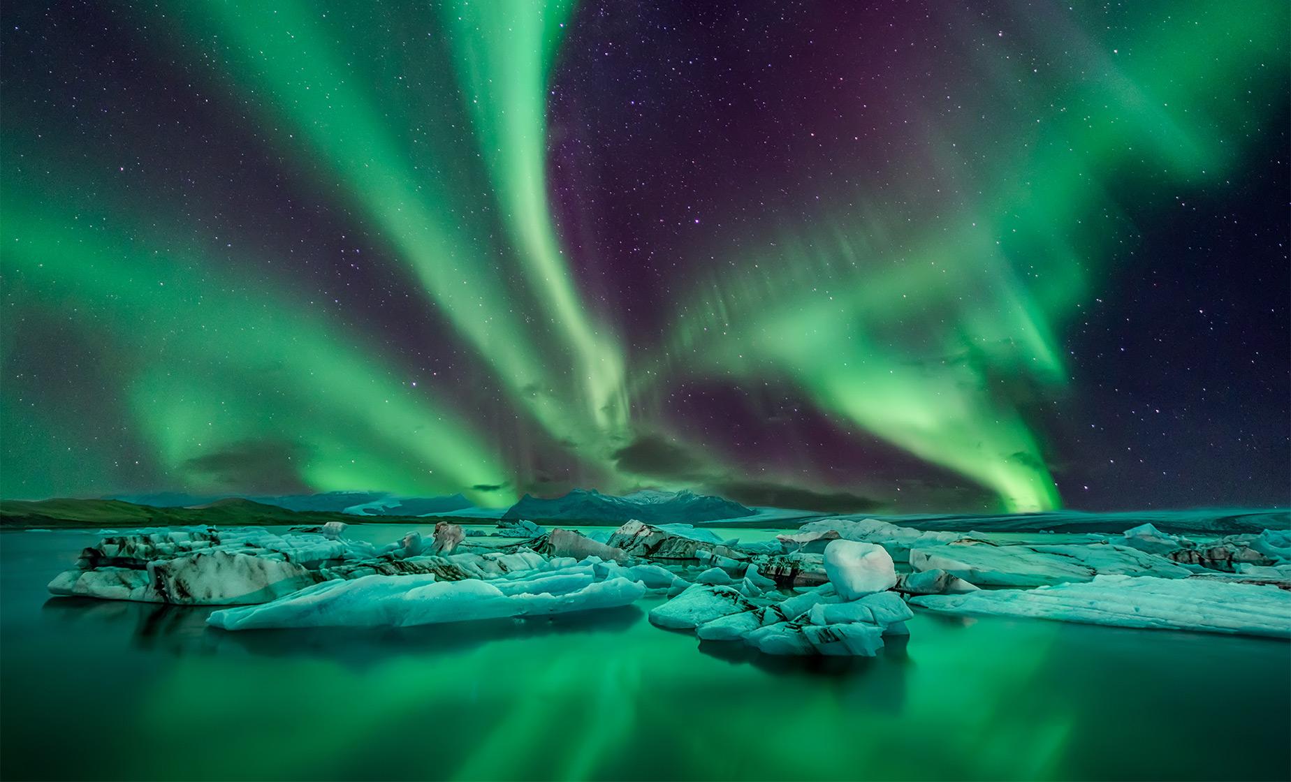 Image of the Northern Lights over Icelandic landscape